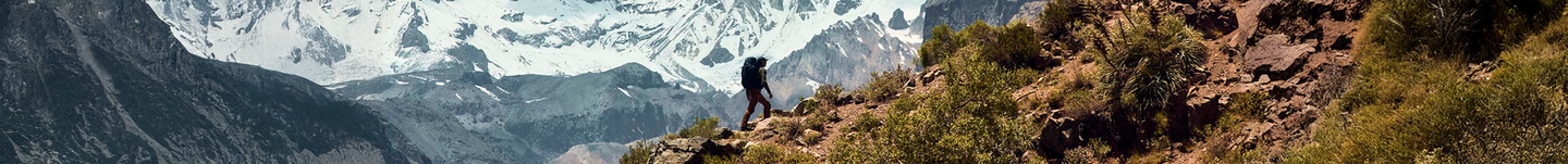 Hiker walking up a mountain with their Baltoro men's pack. Scroll down below to shop for packs based on their liter sizes.
